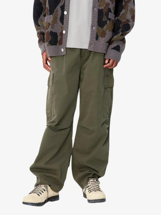 Image of a model wearing Pants. Productname: Carhartt Wip Cole Cargo Pant in Office Green colour by brand - Carhartt Wip
