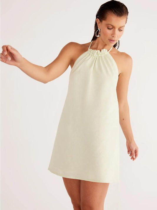 Image of a model wearing Dress. Productname: SNDYS Alysse Halter Dress in Matcha colour by brand - SNDYS
