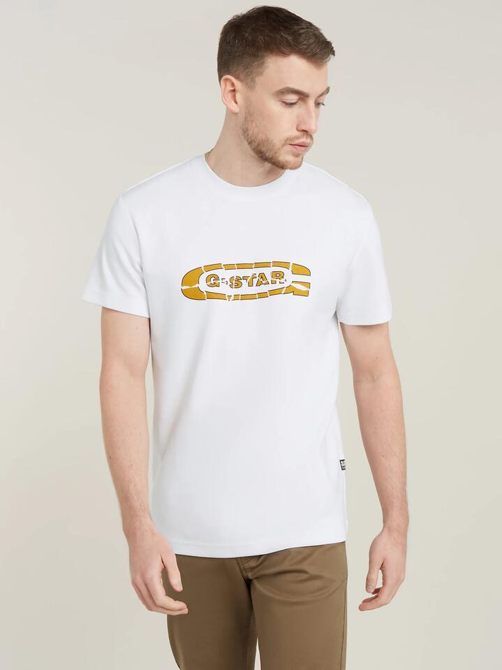 Image of a model wearing Tops. Productname: G-Star Destroyed Old Skool Logo R Tee in White colour by brand - G-Star