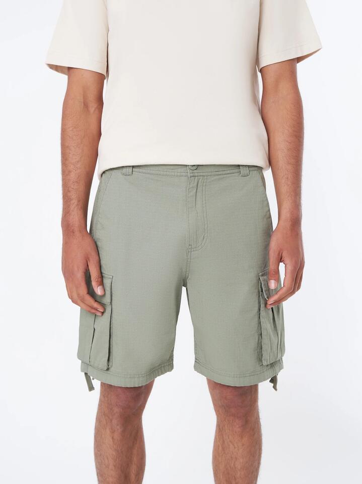 Image of a model wearing Shorts. Productname: Article One Wyatt Cargo Short - Willow in Willow colour by brand - Article One