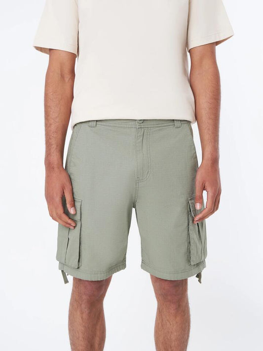 Image of a model wearing Shorts. Productname: Article One Wyatt Cargo Short - Willow in Willow colour by brand - Article One