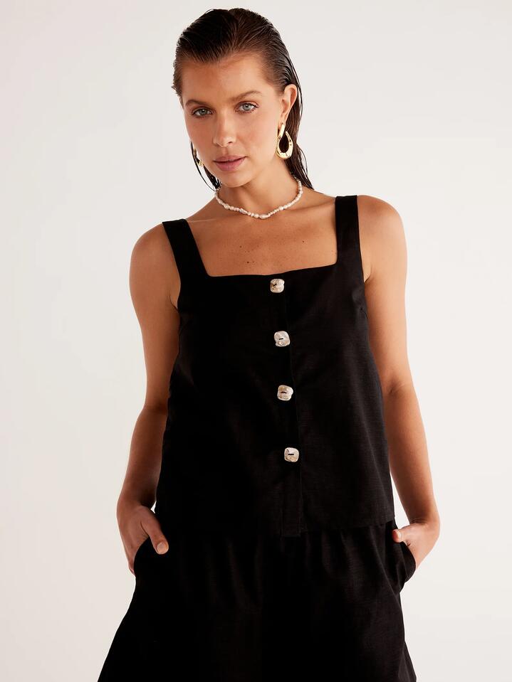 Image of a model wearing Tops. Productname: SNDYS Shelley Top in Black colour by brand - SNDYS
