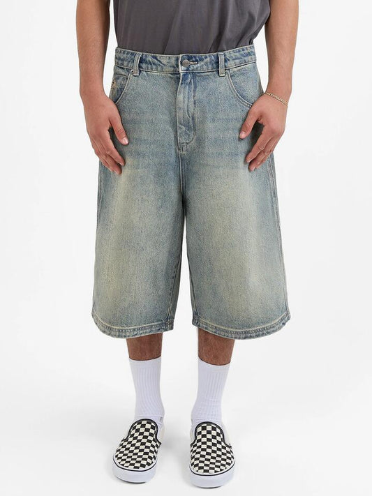 Image of a model wearing Denim. Productname: Worship Dozer Jeanshort in Garbage Grime Blue colour by brand - Worship