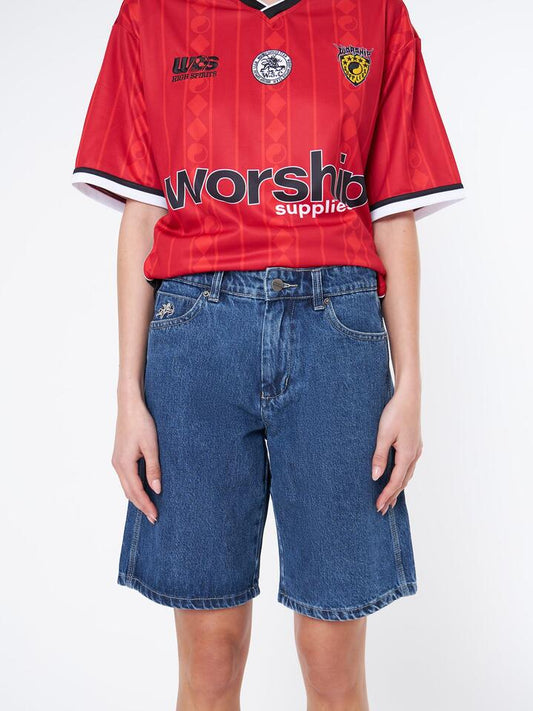 Image of a model wearing Shorts. Productname: Worship Alt Slate Sloucher Short in Worn Blue Rinse colour by brand - Worship