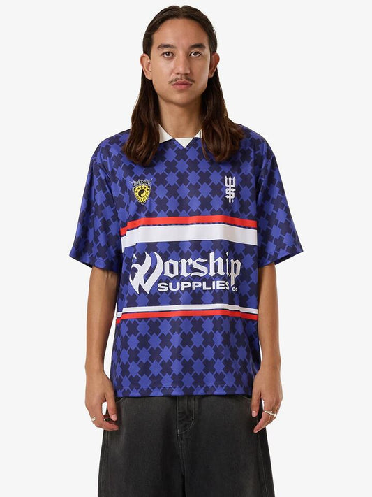 Image of a model wearing Tops. Productname: Worship Offside Football Jersey in Blue Depths colour by brand - Worship