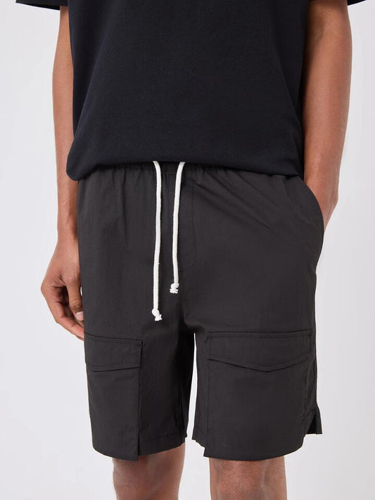 Image of a model wearing Shorts. Productname: Barney Cools Valance Short in Black colour by brand - Barney Cools