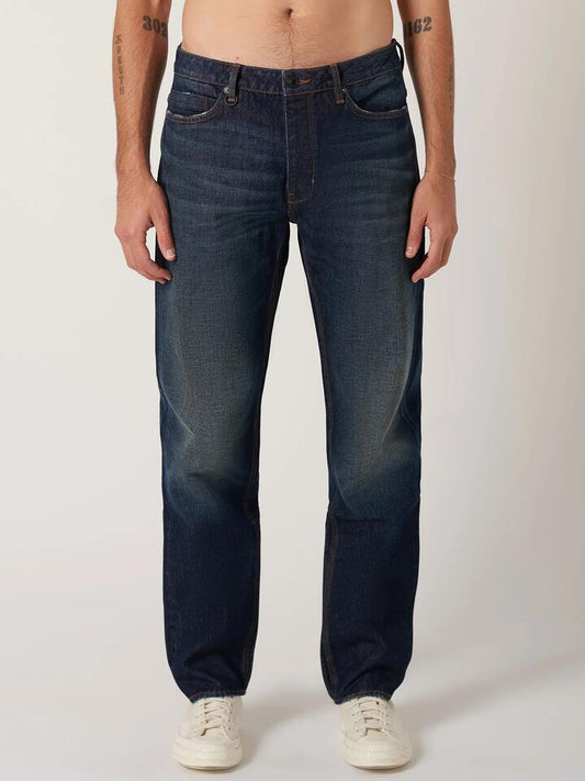 Image of a model wearing Denim. Productname: Neuw Liam Loose Serial in Organic Dark Blue colour by brand - Neuw