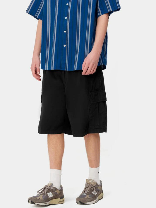 Image of a model wearing Shorts. Productname: Carhartt Wip Cole Cargo Short in Black colour by brand - Carhartt Wip