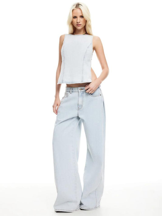 Image of a model wearing Tops. Productname: Lioness Rider Backless Top in Light Denim colour by brand - Lioness