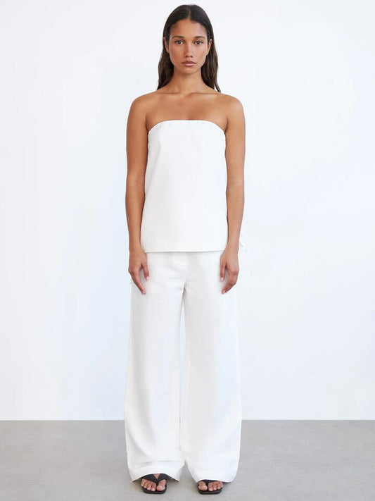 Image of a model wearing Pants. Productname: Lulu & Rose Olivia Pant in White colour by brand - Lulu & Rose