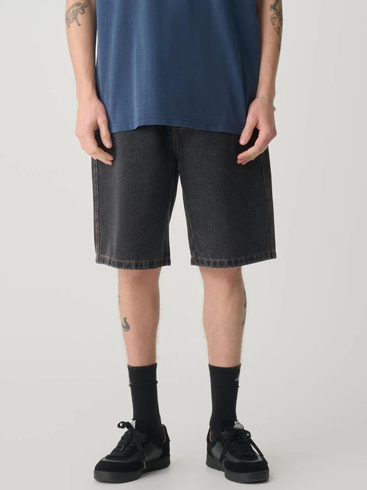 Image of a model wearing Denim. Productname: S-Double Denim Standard Short in Washed Black colour by brand - S-Double