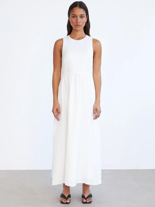 Image of a model wearing Dress. Productname: Lulu & Rose Charlotte Midi Dress in Off White colour by brand - Lulu & Rose