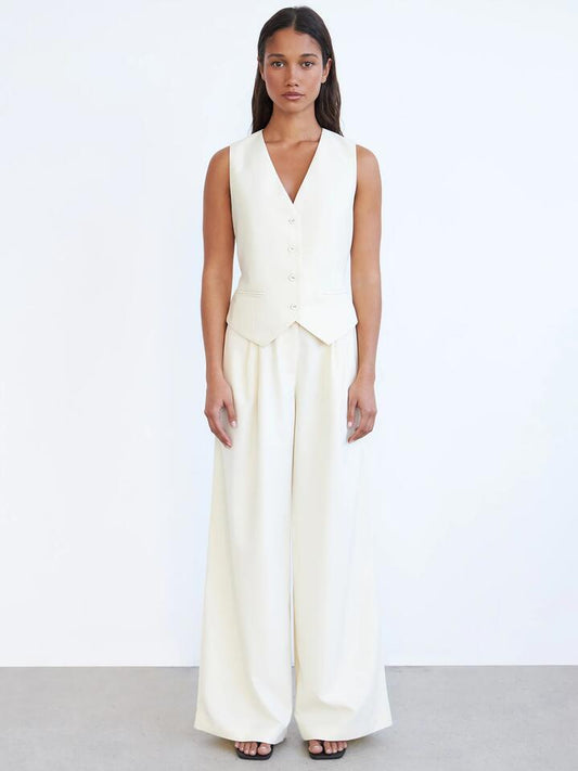 Image of a model wearing Pants. Productname: Lulu & Rose Ellie Pant in Panna Cotta colour by brand - Lulu & Rose
