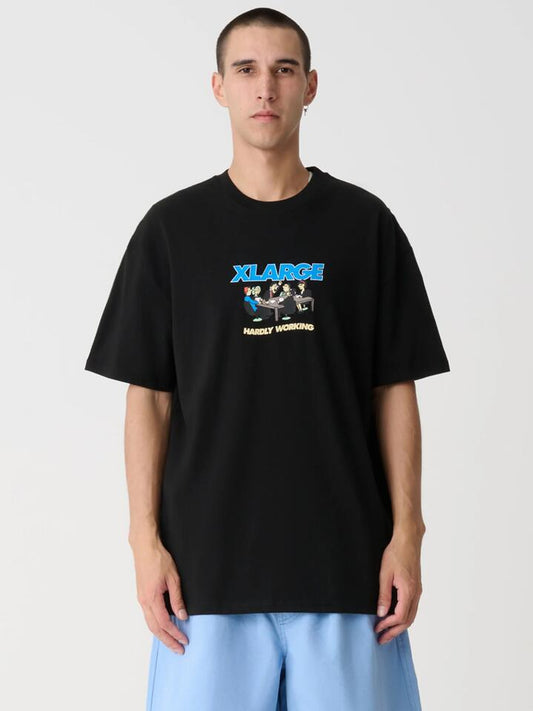 Image of a model wearing Tops. Productname: Xlarge Hardly Working Tee in Black colour by brand - Xlarge