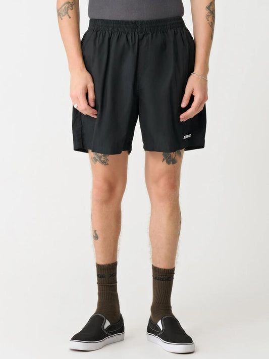 Image of a model wearing Shorts. Productname: Xlarge 91 Stock Beachshort in Black colour by brand - Xlarge