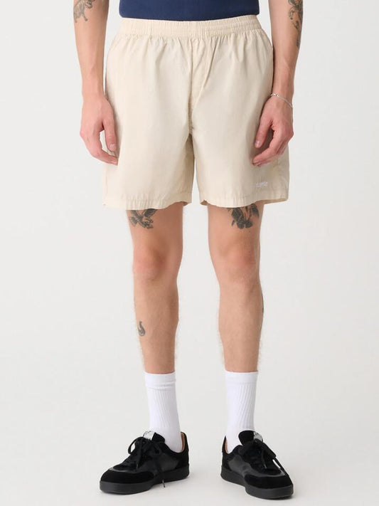 Image of a model wearing Shorts. Productname: Xlarge 91 Stock Beachshort in Khaki colour by brand - Xlarge