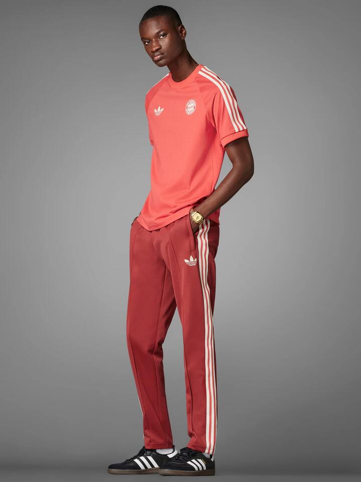Image of a model wearing Tops. Productname: Adidas FC Bayern T-Shirt in Crew Red colour by brand - Adidas