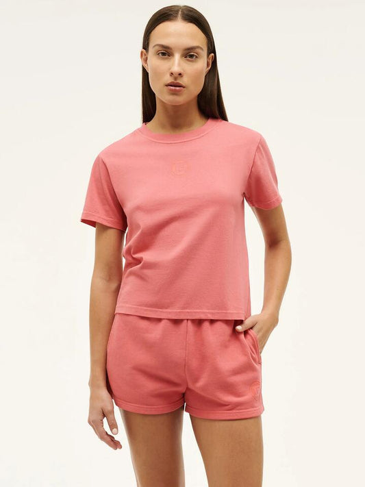 Image of a model wearing Shorts. Productname: Pe Nation Sportive Short Sleeve Tee in Poppy Red colour by brand - Pe Nation