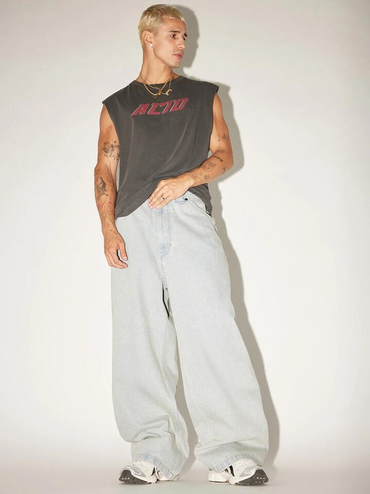 Image of a model wearing Denim. Productname: Abrand A7 Mega Baggy Wayne in Bleached Vintage Indigo colour by brand - Abrand