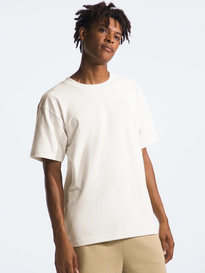 Image of a model wearing Tops. Productname: Evolution Box Fit Tee in White Dune colour by brand - The North Face