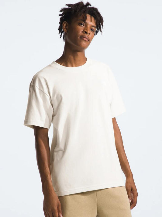 Image of a model wearing Tops. Productname: The North Face Evolution Box Fit Tee in White Dune colour by brand - The North Face