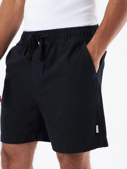 Image of a model wearing Shorts. Productname: Article One Benzo Short in Black colour by brand - Article One