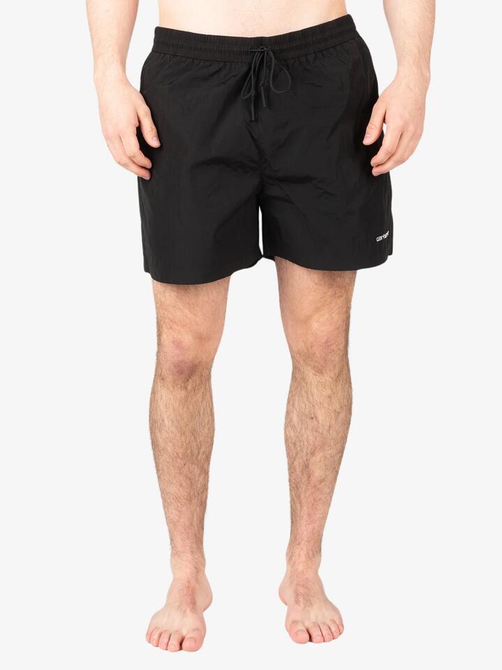 Image of a model wearing Shorts. Productname: Carhartt Wip Tobes Swim Trunks in Black/White colour by brand - Carhartt Wip