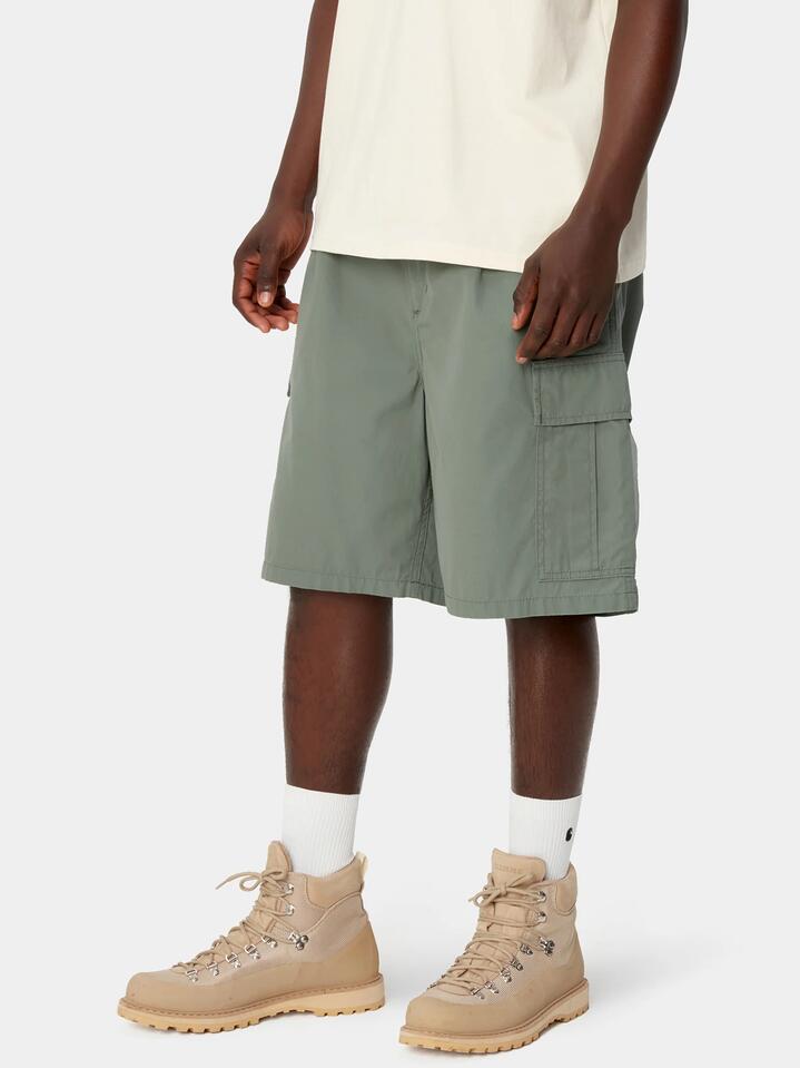 Image of a model wearing Shorts. Productname: Carhartt Wip Cole Cargo Short in Park colour by brand - Carhartt Wip