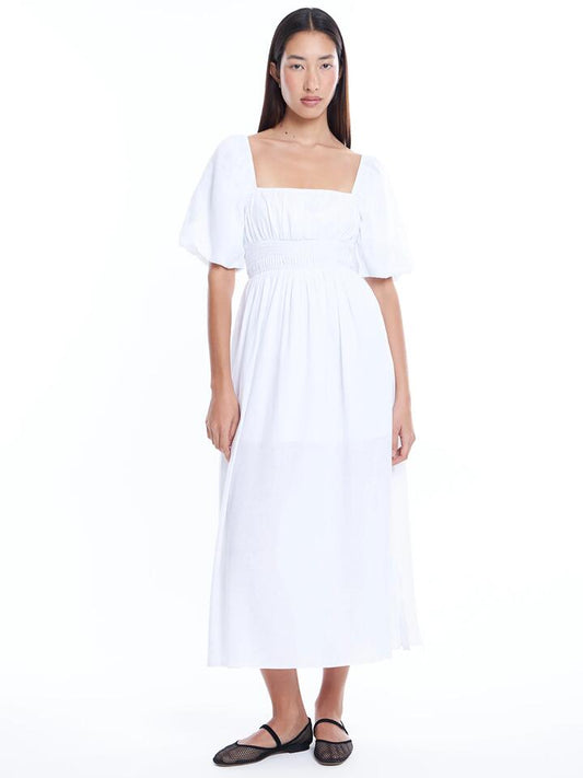 Image of a model wearing Dress. Productname: Lulu & Rose Lucy Midi Dress in Off White colour by brand - Lulu & Rose
