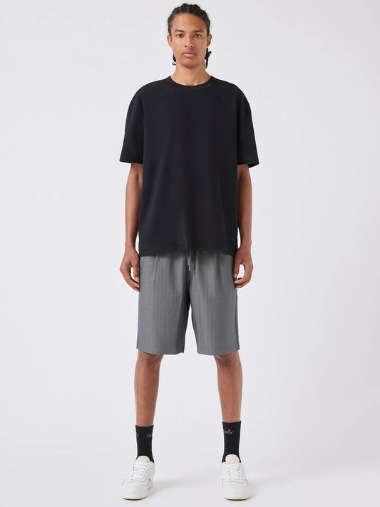 Image of a model wearing Shorts. Productname: Barney Cools Boxy Suit Short in Grey Herringbone colour by brand - Barney Cools
