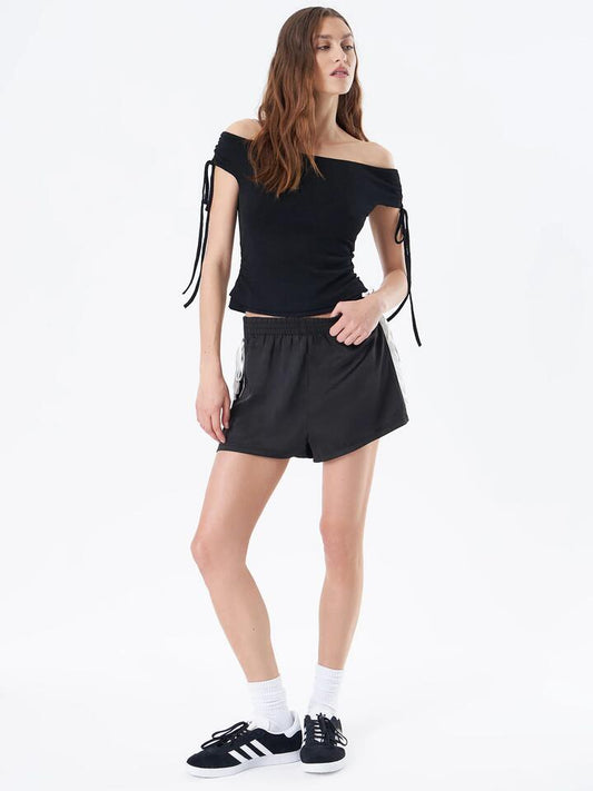 Image of a model wearing Shorts. Productname: Beyond Her Nori Mini Short in Black colour by brand - Beyond Her