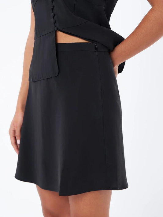 Image of a model wearing Skirts. Productname: Lulu & Rose Meg Mini Skirt in Black colour by brand - Lulu & Rose