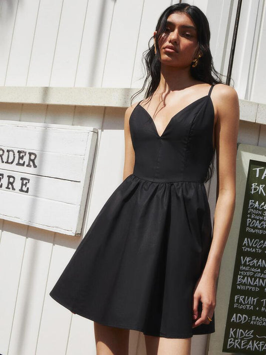 Image of a model wearing Dress. Productname: Lulu & Rose Lillian Mini Dress Black in Black colour by brand - Lulu & Rose