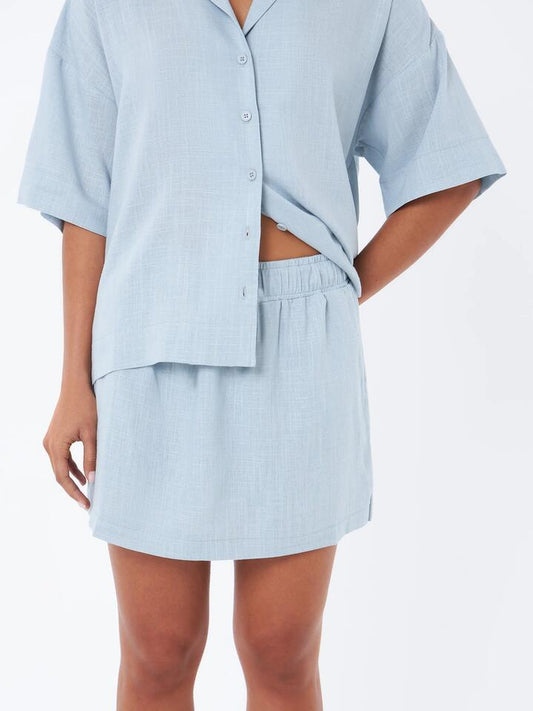 Image of a model wearing Skirts. Productname: Lulu & Rose L&R Drawstring Mini Skirt in Icy Aqua colour by brand - Lulu & Rose
