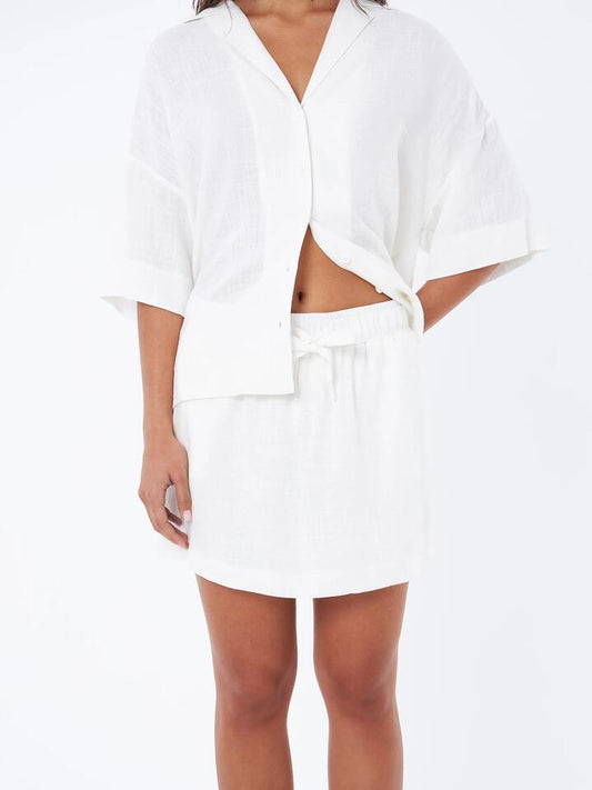 Image of a model wearing Pants. Productname: Lulu & Rose L&R Drawstring Mini Skirt in Off White colour by brand - Lulu & Rose