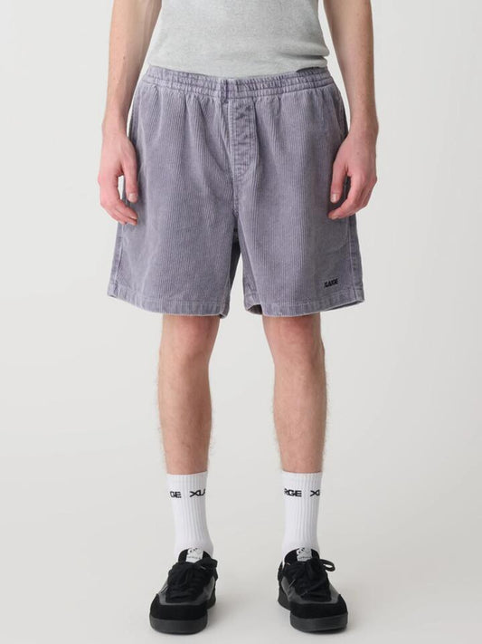 Image of a model wearing Shorts. Productname: Xlarge 91 Wide Cord Beachshort in Pigment Mauve colour by brand - Xlarge
