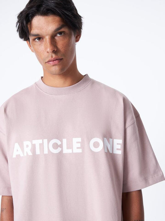 Image of a model wearing Tops. Productname: Article One Bold Logo Tee in Lavender colour by brand - Article One