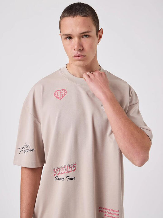 Image of a model wearing Tops. Productname: Barney Cools Tour Tee in Sand colour by brand - Barney Cools