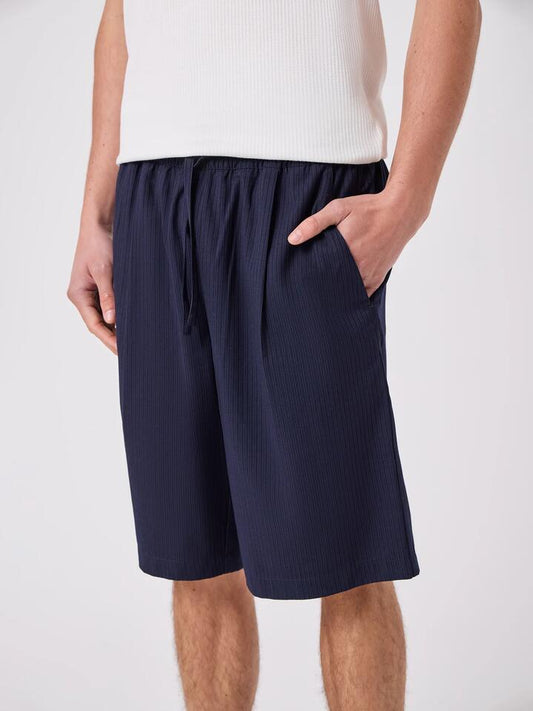 Image of a model wearing Shorts. Productname: Barney Cools Boxy Suit Short in Grey/Blue colour by brand - Barney Cools