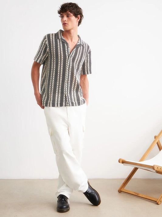 Image of a model wearing Pants. Productname: Carhartt Wip Stanton Cargo Pant in Wax colour by brand - Carhartt Wip