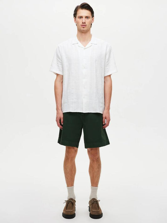 Image of a model wearing Shorts. Productname: Neuw River Relaxed Short in Hunter Green colour by brand - Neuw