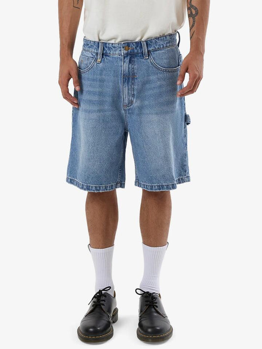 Image of a model wearing Denim. Productname: Thrills Slacker Denim Short in Tempest Blue colour by brand - Thrills