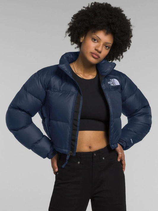 Image of a model wearing Outerwear. Productname: The North Face Nuptse Short Jacket in Summit Navy colour by brand - The North Face
