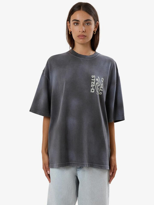 Image of a model wearing Tops. Productname: Thrills Firestarter Oversized Tee in Merch Black Fade colour by brand - Thrills