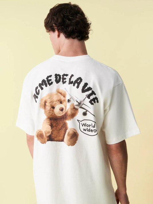 Image of a model wearing Tops. Productname: ADLV World Wide Airplane Bear Tee in Cream colour by brand - ADLV