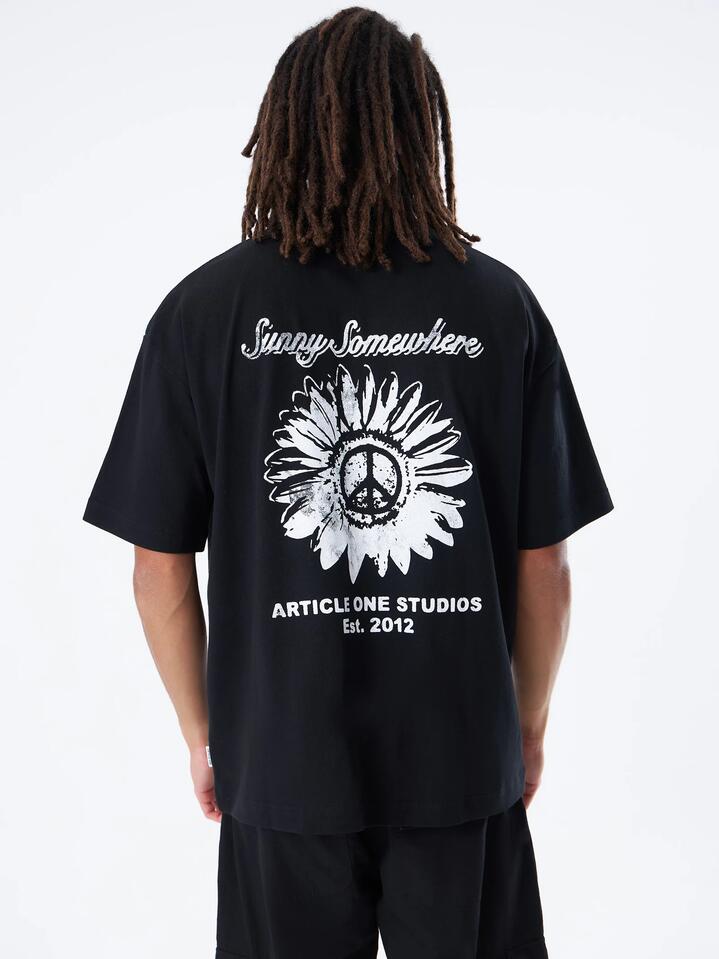 Image of a model wearing Tops. Productname: Article One Sunny Somewhere Boxy Tee in Black colour by brand - Article One
