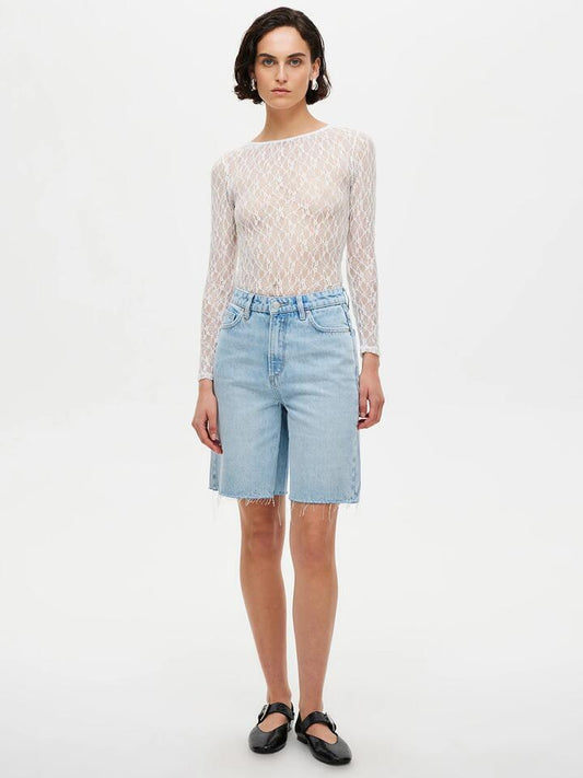 Image of a model wearing Shorts. Productname: Neuw Phoebe Short Jetlag in Mid Vintage Indigo colour by brand - Neuw