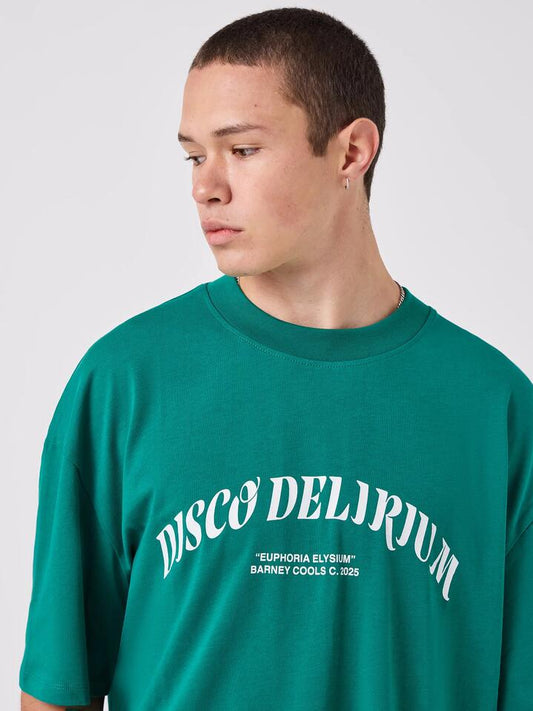 Image of a model wearing Tops. Productname: Barney Cools Delirium Tee in College Green colour by brand - Barney Cools