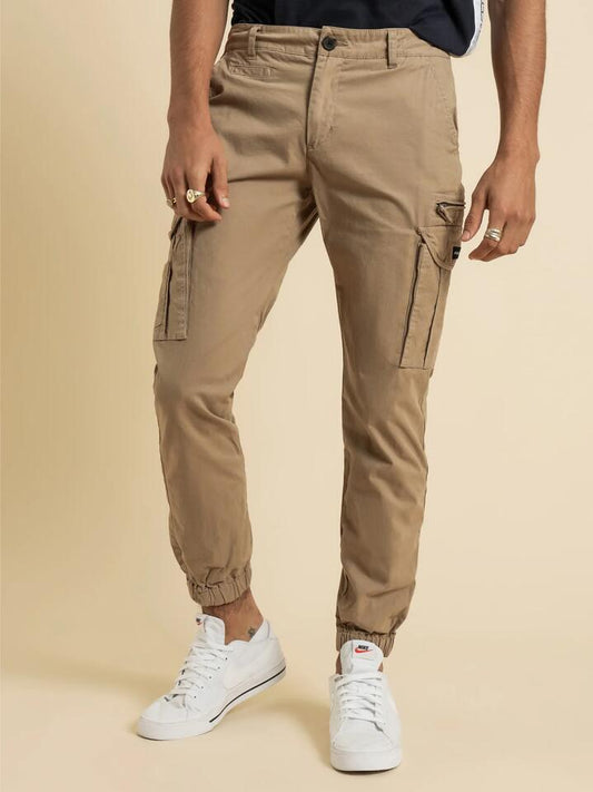 Image of a model wearing Pants. Productname: Henleys Eagle Pant in Desert Sand colour by brand - Henleys