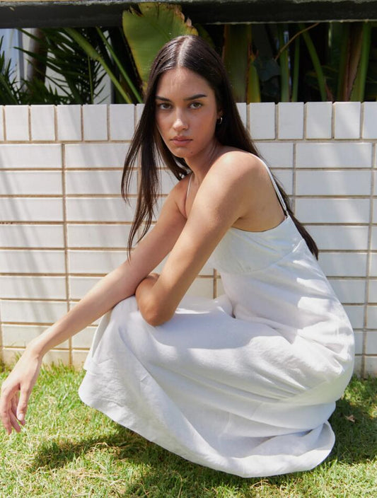 Image of a model wearing Dress. Productname: Lulu & Rose Paige Maxi Dress in Off White colour by brand - Lulu & Rose